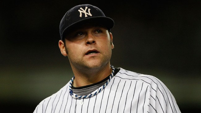 Joba Chamberlain looks on walking off the mound