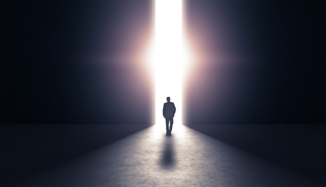 Man walking towards light life after death