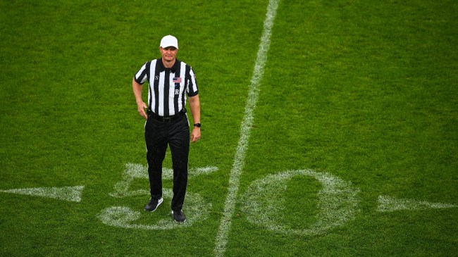 A referee makes a call during a game between Navy and Notre Dame.