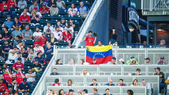 Baseball fans sit in the outfield stands at an Atlanta Braves game.