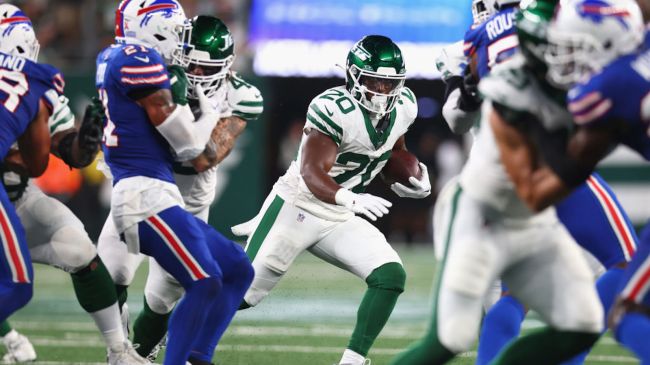 breece hall running the ball against the bills