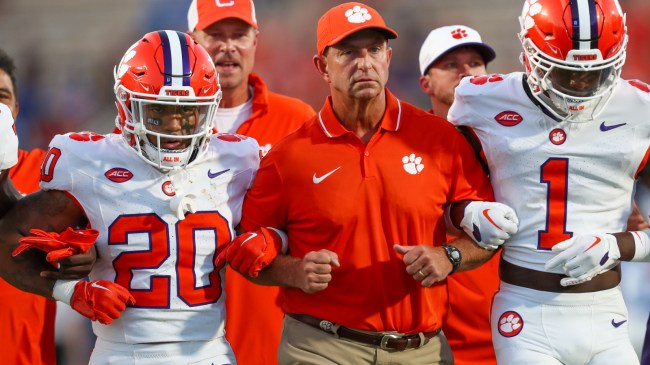 Dabo Swinney walks onto the field with Clemson players before a game vs. Duke.