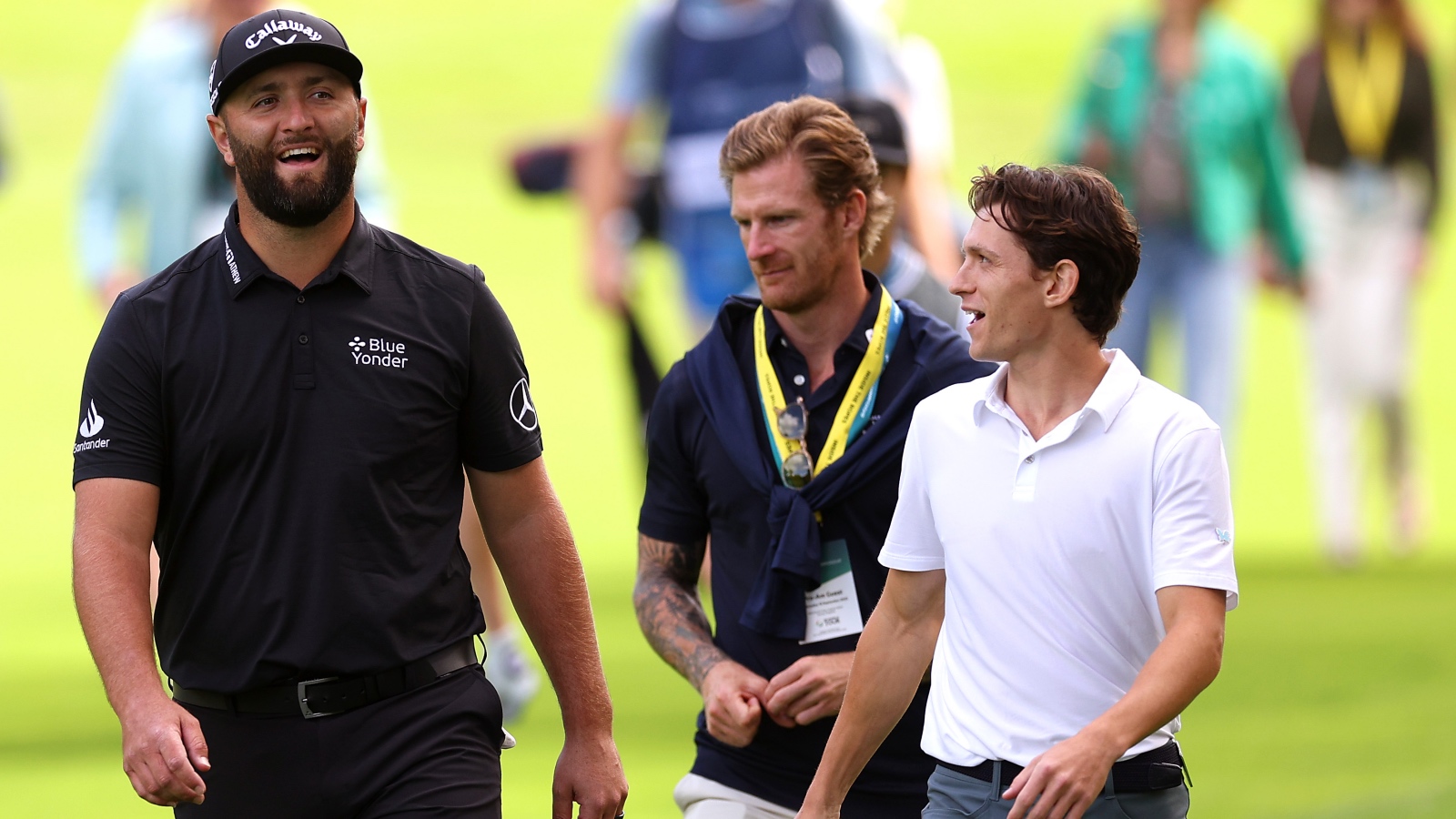 Tom Holland playing golf with Jon Rahm