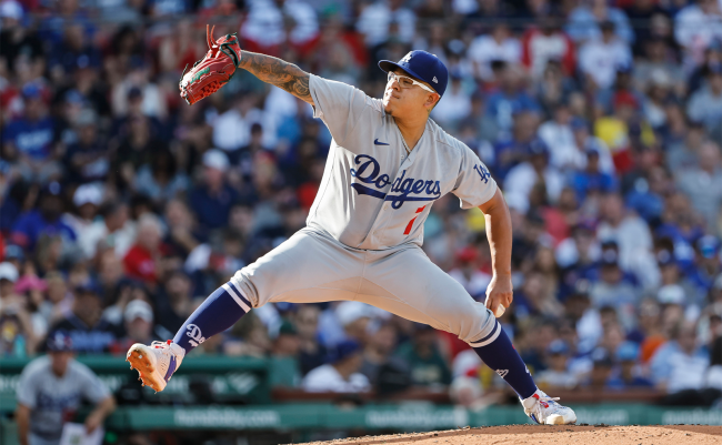 julio urias throws a pitch
