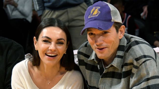 mila kunis and ashton kutcher at a lakers game