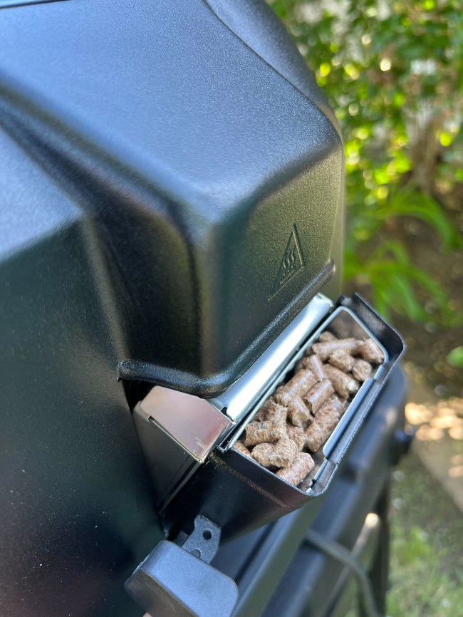 The wood pellets in the box of the Ninja Woodfire™ Pro Connect XL Outdoor Grill & Smoker