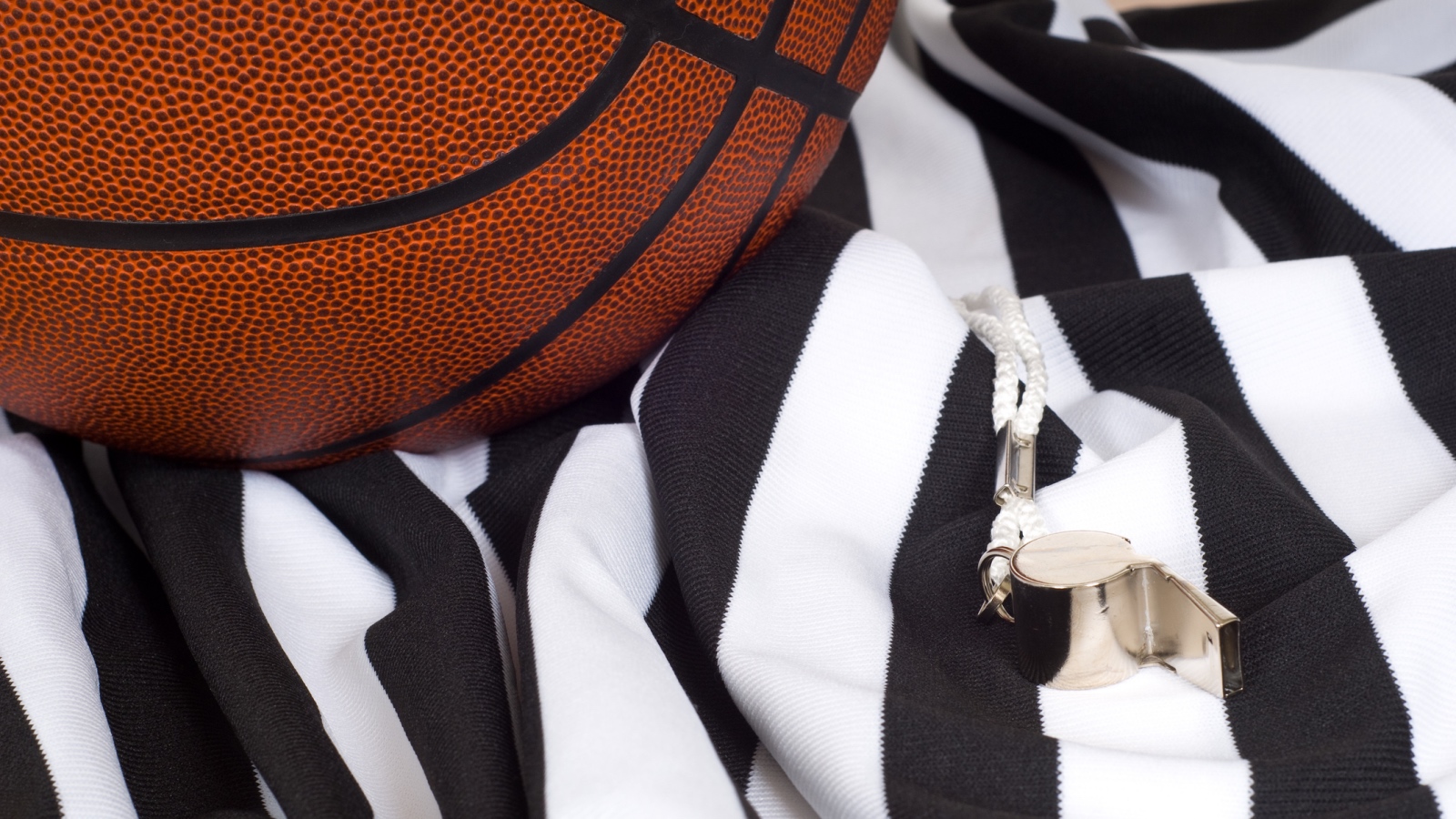 basketball referee shirt and whistle