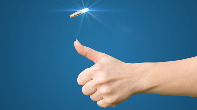 hand flipping a coin toss