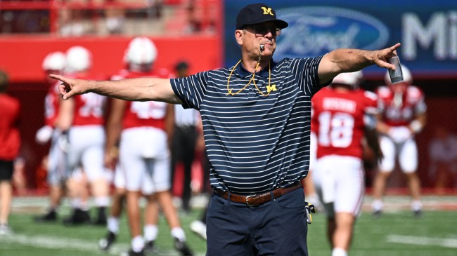 Michigan head coach Jim Harbaugh directs his team before a game.