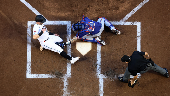 jonah heim tagged out christian walker at home in world series