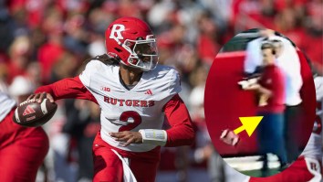 College FB Photographer Goes Down Like He Was Hit By Sniper After Brutal Nutshot On Awful Errant Throw