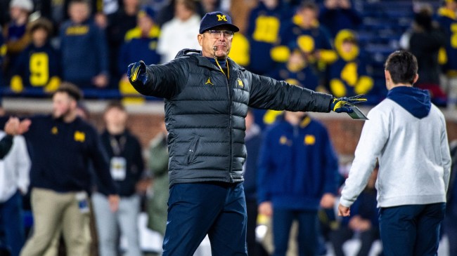 Jim Harbaugh directs his team before a game.