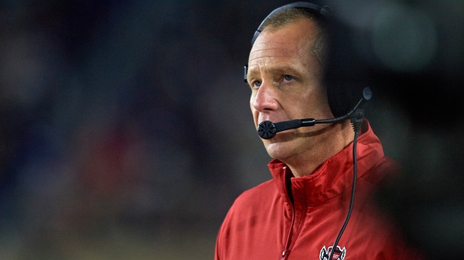 NC State head coach Dave Doeren walks the sidelines during a game.