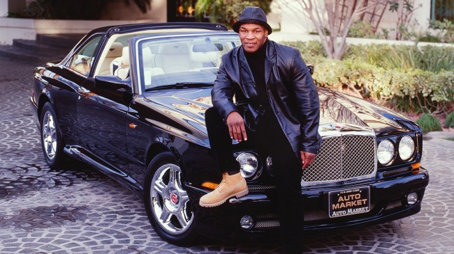 Mike Tyson sitting on Bentley