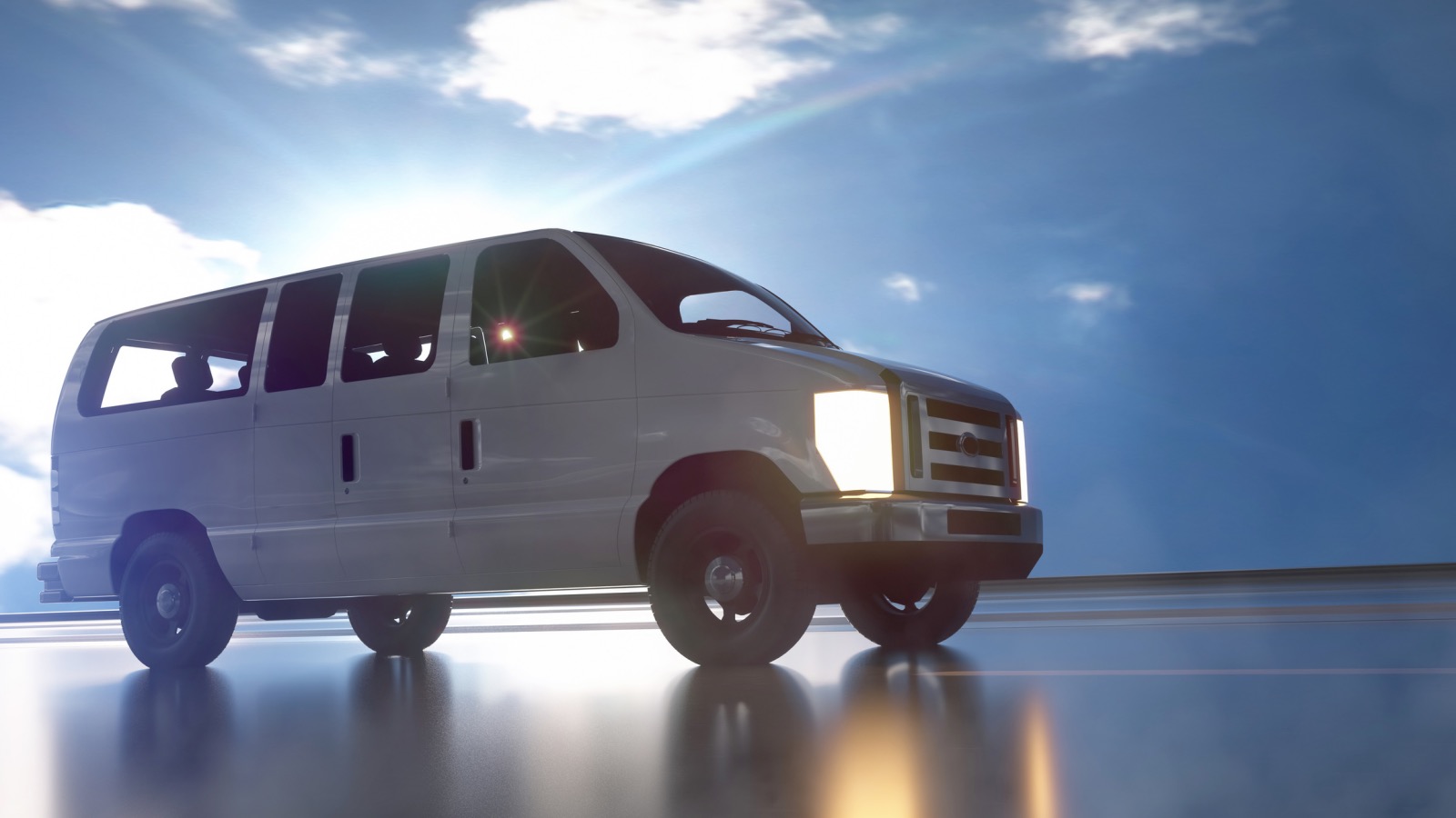 minivan with its lights on