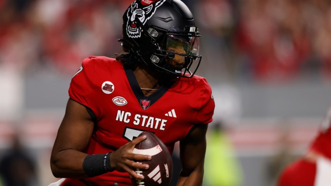 MJ Morris scrambles in a game between NC State and Miami.