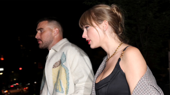 taylor swift walks with travis kelce