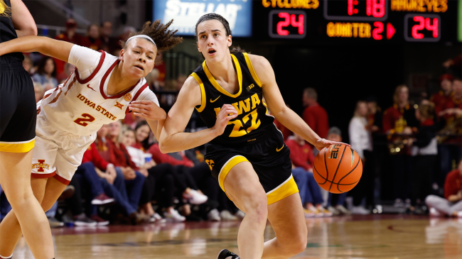Caitlin Clark Iowa Hawkeyes drives against Iowa State Cyclones