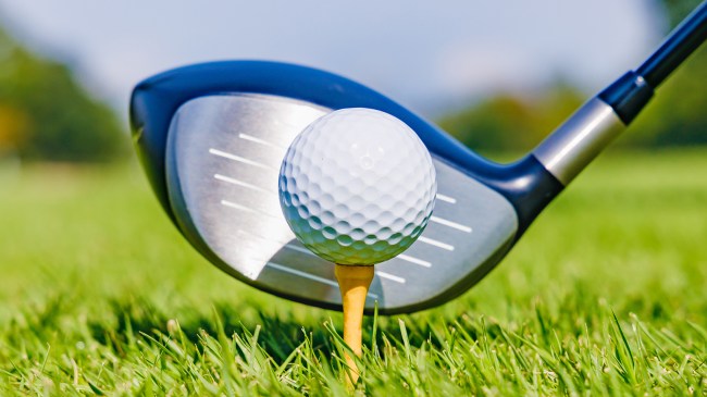 driver hitting golf ball off tee