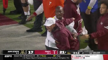 Troy Coach Needs Multiple Staffers To Hold Him Back While Going Ballistic On Referee During WILD Tirade