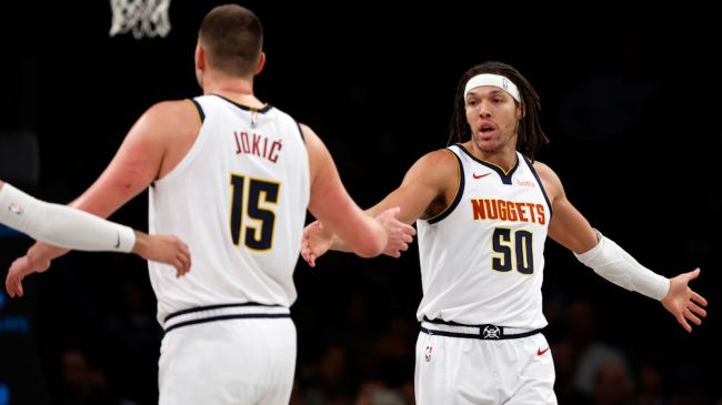 nikola jokic and aaron gordon highfiving
