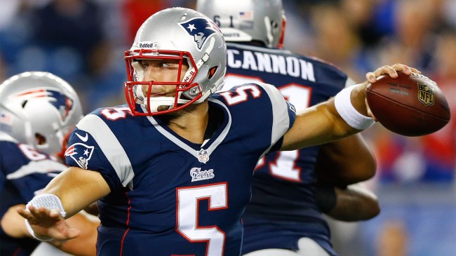 Tim Tebow 5 of the New England Patriots throws a pass