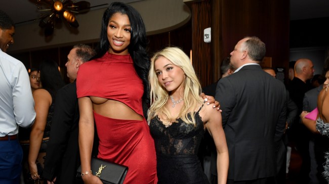 Angel Reese poses for a photo with LSU gymnast Livvy Dunne.