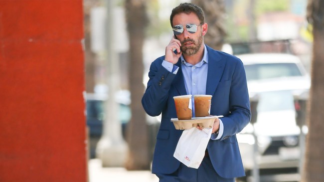 Ben Affleck carrying Dunkin bag and drinks