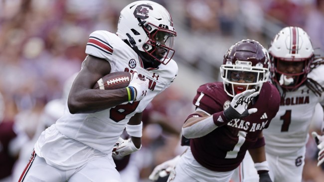 South Carolina WR Nyckoles Harbor runs past Texas A&M defenders.