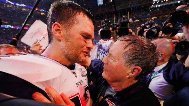 Tom brady and bill belichick celebrating winning the super bowl