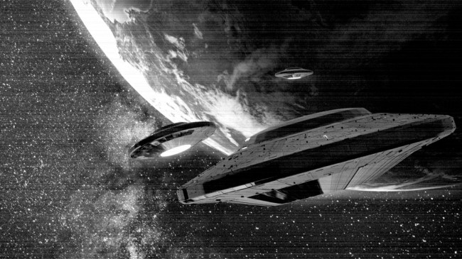 UFOs alien spaceships approaching planet Earth