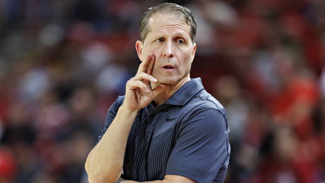 Eric Musselman talks to his Arkansas team from the bench.