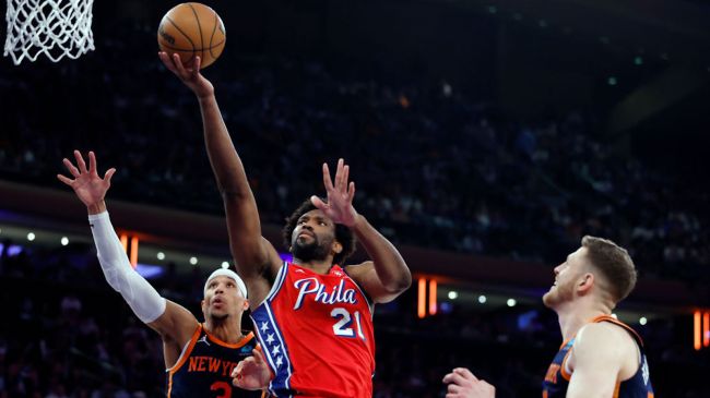 joel embiid attempting a layup against the knicks