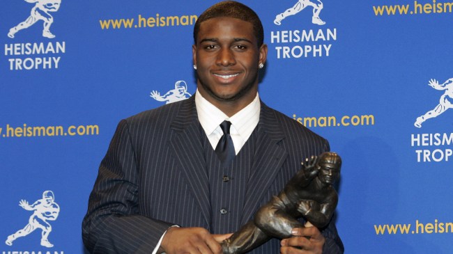 Reggie Bush holding Heisman Trophy