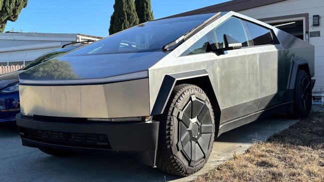 tesla cybertruck parked in a driveway