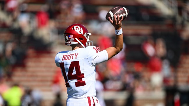 Oklahoma QB General Booty warms up before a game.