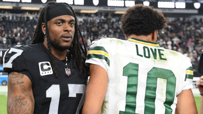 davante adams and jordan love shaking hands