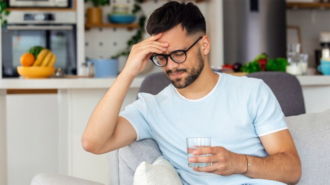 man suffering from hangover