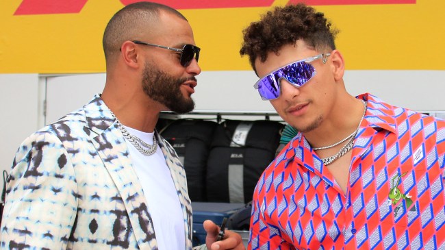 Dak Prescott talks with Patrick Mahomes at the Formula 1 Miami Grand Prix