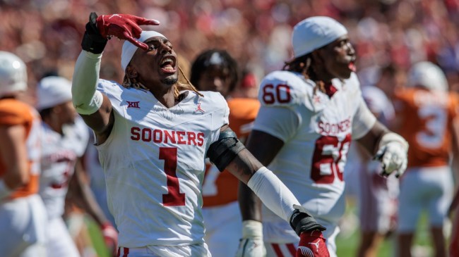 An Oklahoma player flashes a 'Horns Down' sign after beating Texas.