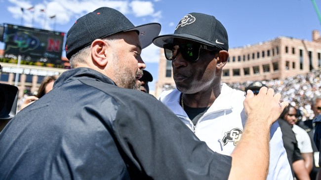 Matt Rhule and Deion Sanders shake hands after a game between Nebraska and Colorado.
