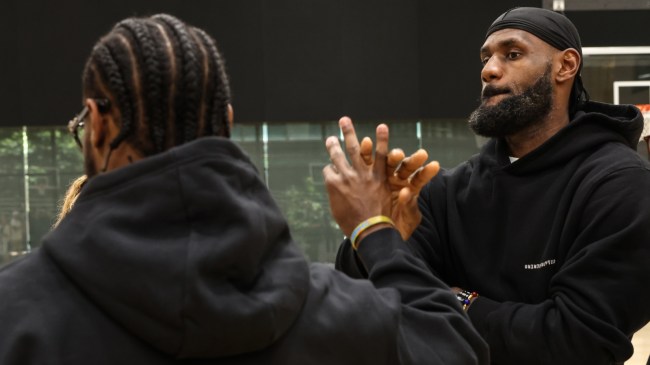 Bronny James shakes hands with dad, LeBron.
