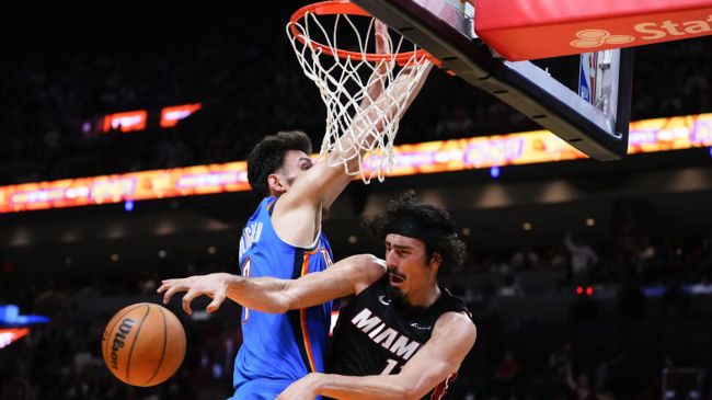 chet holmgren dunking on miam heat player