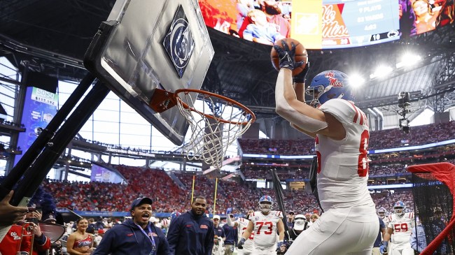 An Ole Miss football player celebrates on the sidelines during a bowl game vs. Penn State.