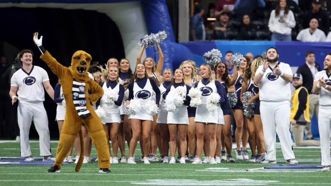 Penn State cheerleaders on the field before a football game against Ole Miss.
