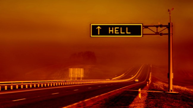 Road to hell sign on highway