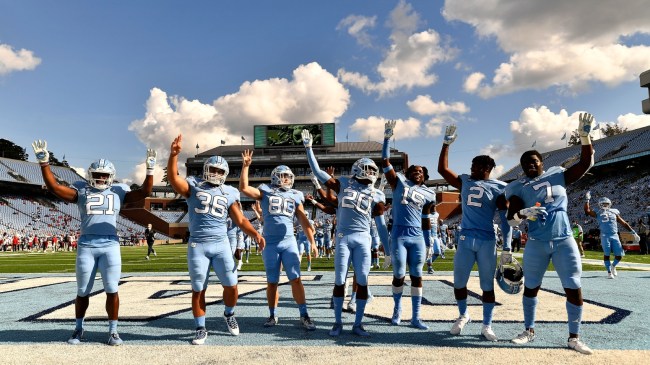 UNC football players gesture to the students' section before the fourth quarter.