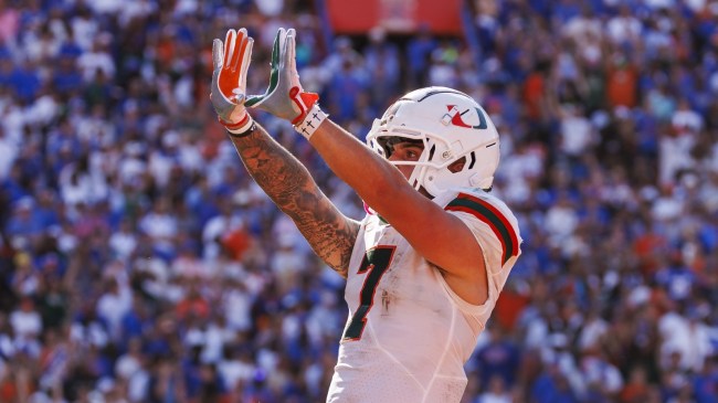 Miami WR Xavier Restrepo celebrates after scoring a touchdown.