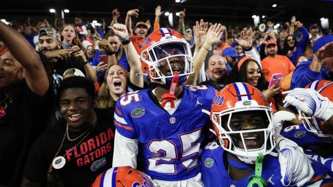 Florida football players celebrate with Cormani McClain after a touchdown.