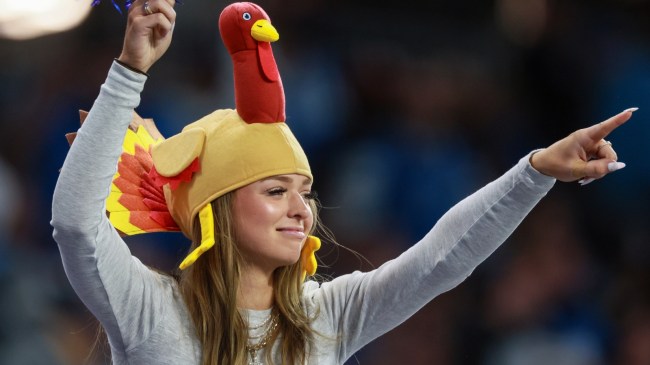 A Detroit Lions fan cheers during an NFL game on Thanksgiving Day.